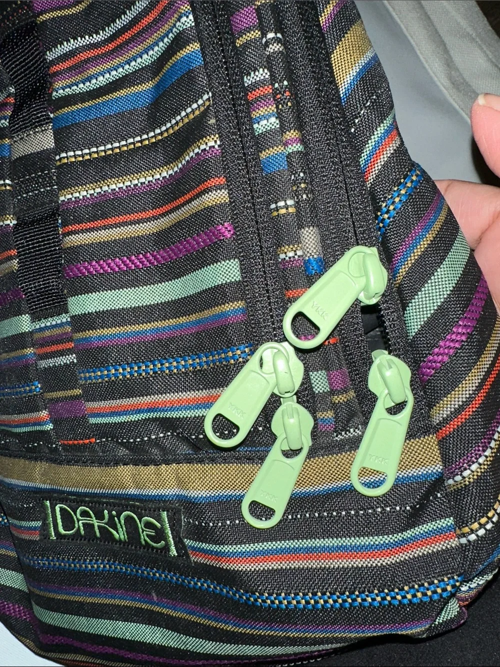 Dakine women’s Striped Backpack in Black, Blue, Purple, Green